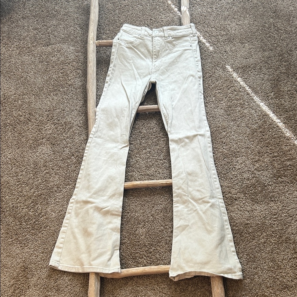 Cream flare jeans